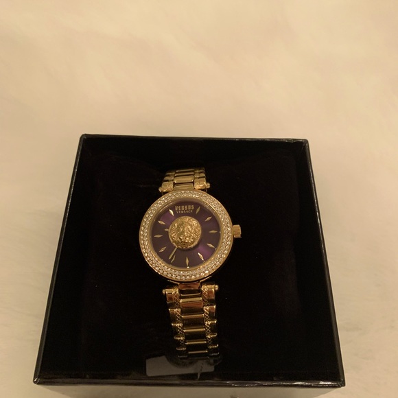 Versus gold watch with maroon face. main image 4